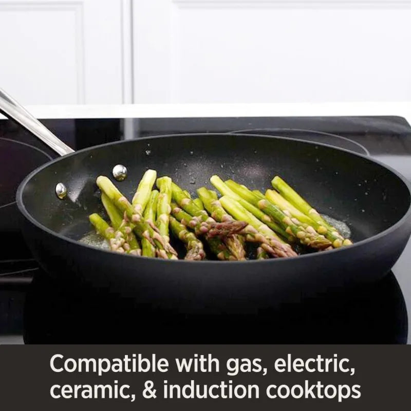 Nonstick fry pan,
Hard anodized,
All-Clad cookware,
Durable construction,
Even heat distribution,
Easy cleanup,
Stainless steel handle,
Comfortable grip,
Induction compatible,
Versatile cooking,
Sautéing,
Frying,
Searing,
Professional quality,
Modern design,
Kitchen essential,
Cookware set,
Ergonomic design,
Sleek appearance,
Long-lasting performance,